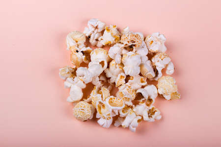 Tasty salted popcorn isolated on beige background.の写真素材