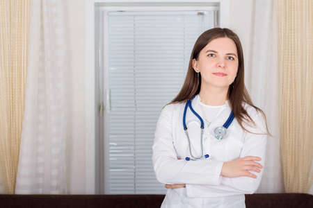 Woman doctor or nurse standing with stethoscope, medicine conceptの写真素材