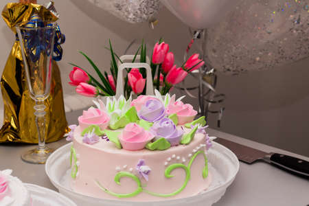 Served festive table with champagne and cakeの写真素材