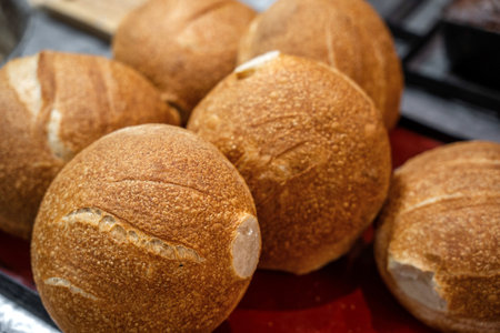 Home baked wheat rolls with fluffy crumb and golden crust for sandwiches.