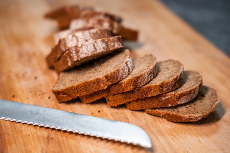 Sliced bread on a wooden cutting board
