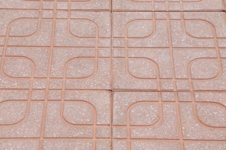 Tiled  stone pavement of the road. Texture Background