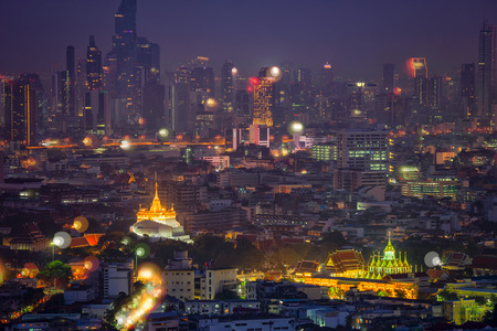 Golden mountain in Wat Saket Ratcha Wora Maha Wihan and Lohaprasat in Wat Ratchanatdaram Worawihan which is landmar in Bangkok, Thailand with bangkok cityscape background.のeditorial素材