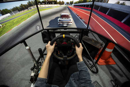 Game console of car simulator with electric accelerator, gear and steering wheel.