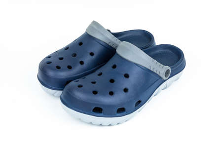 A pair of blue navy sandals with motif design isolated on white background.