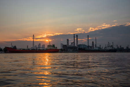 Oil refinery at dawn with sunrise sky in Bangkok ,Thailandの写真素材