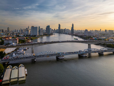 Aerial view of Rama III Bridge and the Krungthep Bridge cross over Chao Phraya river during sunrise...