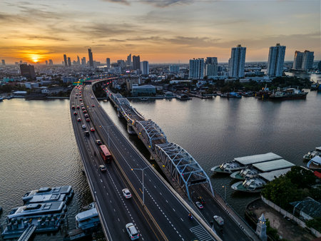 Aerial view of Rama III Bridge and the Krungthep Bridge cross over Chao Phraya river during sunrise...
