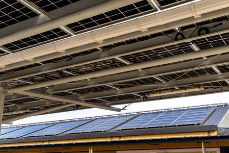 Solar Panel Photovoltaic installation on a Roof of factory, alternative electricity source -...