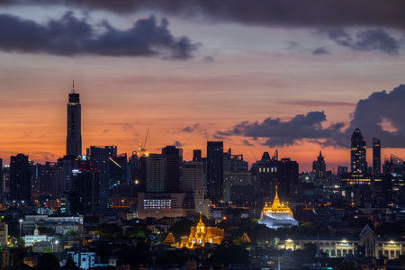 Golden mountain in Wat Saket Ratcha Wora Maha Wihan and Lohaprasat in Wat Ratchanatdaram Worawihan which is landmark in Bangkok, Thailand with bangkok cityscape background.の写真素材