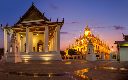 Beautiful sky and Wat Ratchanatdaram Temple in Bangkok, Thailand. Thai architecture: Wat Ratchanadda, Loha Prasat and Traditional Thai pavilion is among the best of Thailand's landmarks.の写真素材