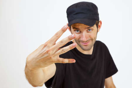 A Man is presenting you four Fingersの写真素材