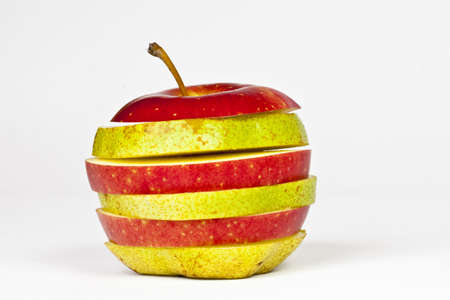 A red Apple and a green Pear in one fruitの写真素材