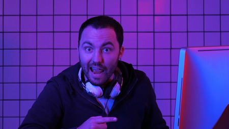 Gamer, hacker, programmer talking about the best software, game, program on the screen of the computer.の写真素材