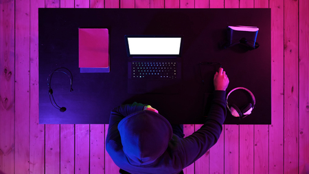 Gamer or streamer watching a game on the screen of laptop. White Display.