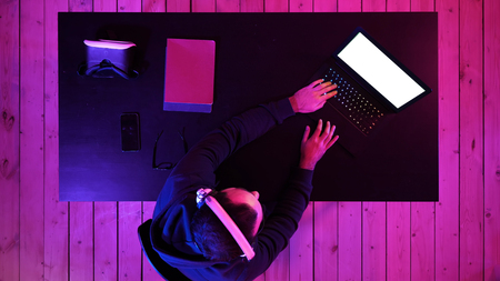 Professional Gamer Playing Video Game on His Laptop. White Display.の写真素材