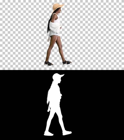 Summer in the city Beautiful african american woman walking on tの写真素材