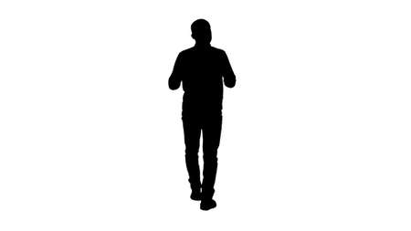 Silhouette Handsome hispanic man model talking to the camera and walking.の写真素材