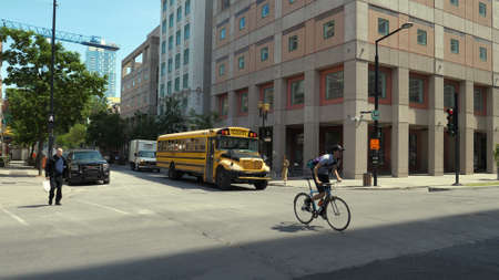 Montreal, Quebec, Canada - 25 June, 2018: School bus stopped at traffic light.