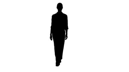 Silhouette Formal young woman walking and smiling.の写真素材