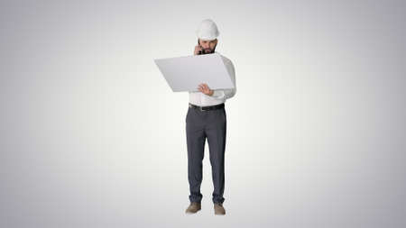 Engineer in formalwear and hardhat talking to client or contract