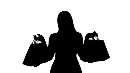 Silhouette Shopping woman happy smiling holding shopping bags iwの写真素材
