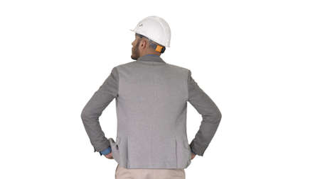 Engineer standing and looking around on white background.