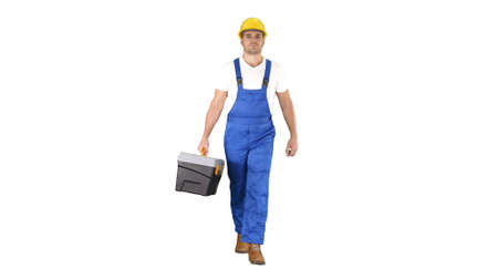 Walking construction worker with toolbox on white background.の写真素材