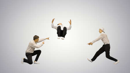 Three guys in white shirts dancing in synch looking at camera on gradient background.