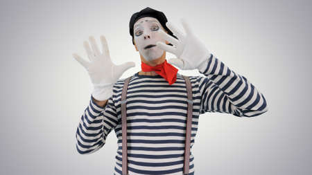 Mime holding touching imaginary wall and making imaginary bird oの写真素材