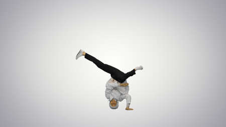 Male doctor in white robe and protective cap dancing breakdanceの写真素材