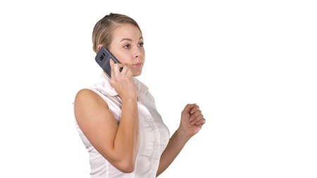 Charming business woman calling with cell telephone while standing