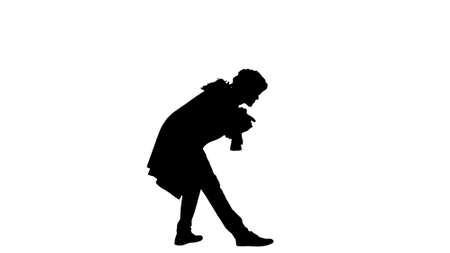 Silhouette Man dressed as a courtier of 17-18 century greets somの写真素材