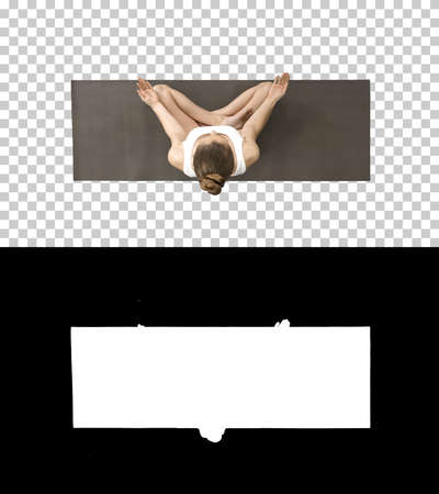 Young woman sitting in lotus pose and meditating, Alpha Channelの写真素材