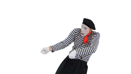 Mime pulling an imaginary rope on white background.の写真素材