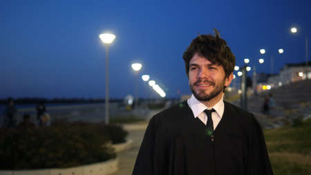 Man walking after the graduation ceremony.