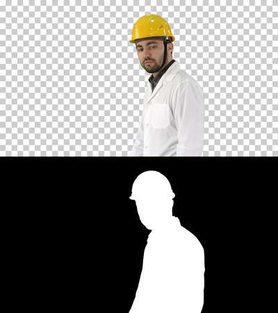 Unhappy construction site engineer talking and walking, Alpha Chの写真素材