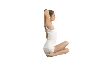Yoga or pilates exercise without mat Gomukasana, Cow Face pose on white background.の写真素材