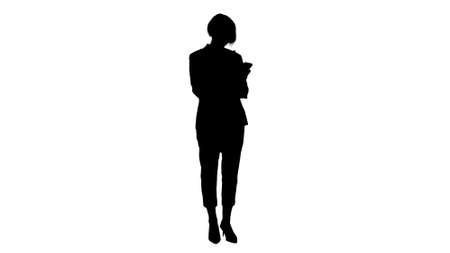 Silhouette Elderly business woman works on a smartphone.の写真素材