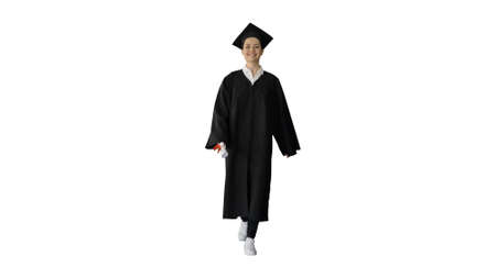 Smiling female student in graduation robe walking with her diploの写真素材