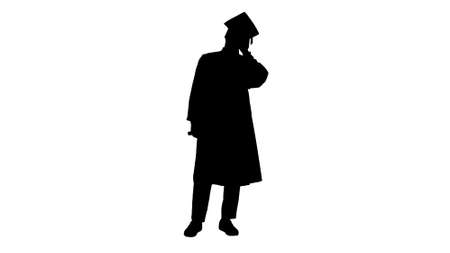 Silhouette Smiling african american male student in graduation rの写真素材
