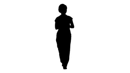 Silhouette A woman construction worker talking to camera in confの写真素材