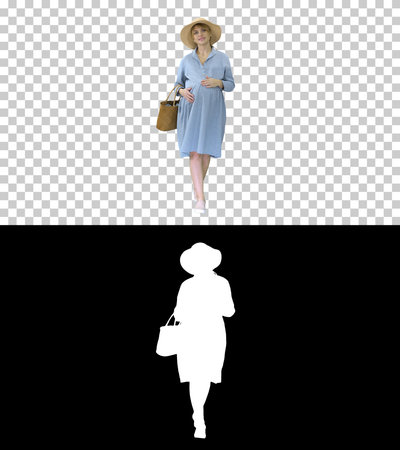 Attractive pregnant woman smiling and walking, Alpha Channel witの写真素材