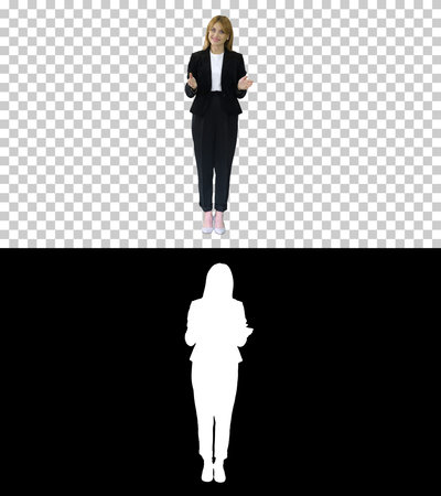 Young business woman presenting something pointing at virtual obの写真素材