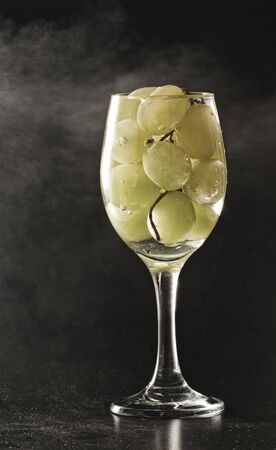 grapes in a wine glassの写真素材