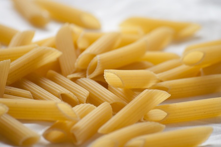 dried italian pasta (macaroni) isolated on white background の写真素材