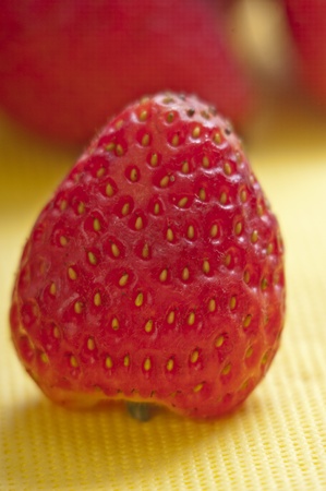 strawberry closeup on a yellow napkinの写真素材