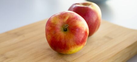 fresh apples on the kitchen tableの写真素材