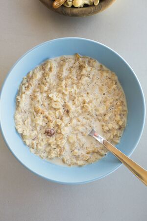oat meal bowl with nuts breakfastの写真素材