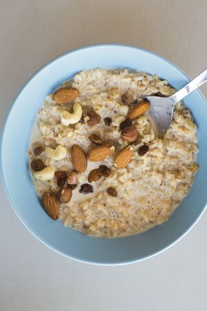 oat meal bowl with nuts breakfastの写真素材